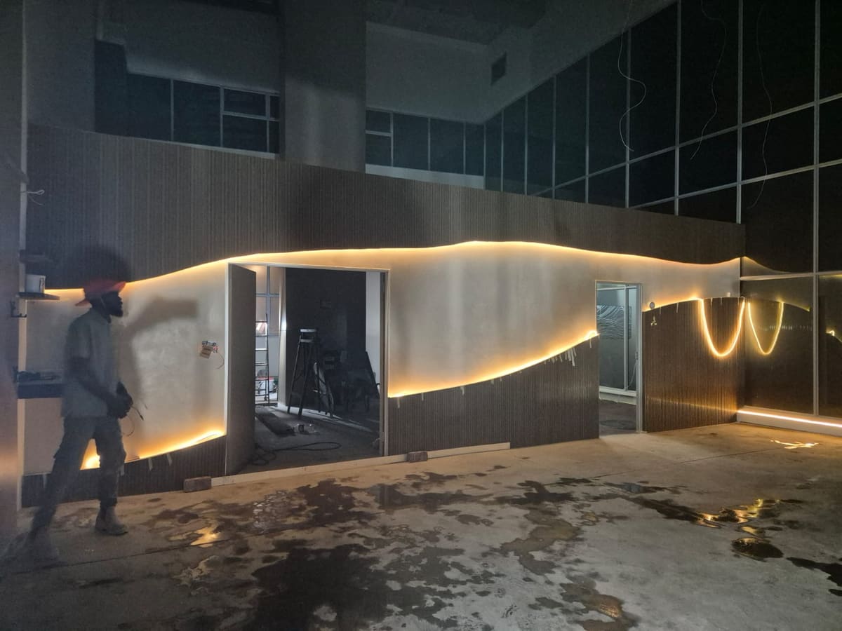 The feature wall under construction, cladding part-fixed and the lighting channel run.